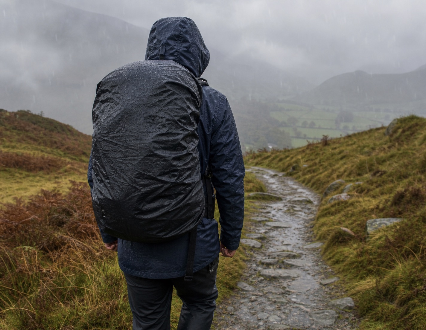 North Face backpack with rain cover during a wet hill walk
