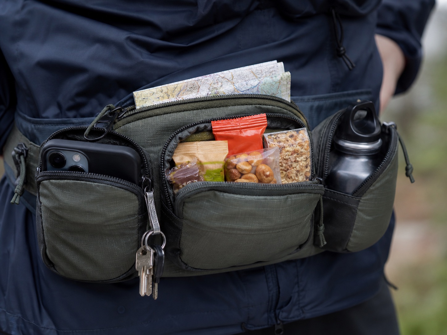 Waist pack pocket organisation with phone keys snacks and map