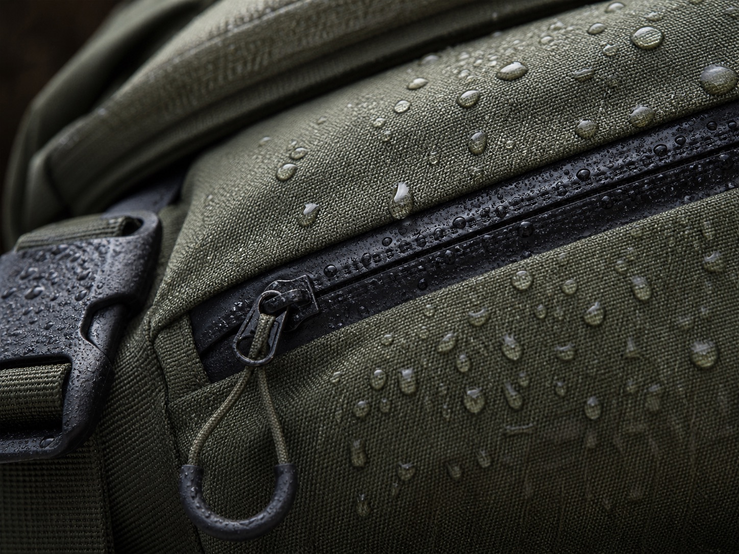 Water-resistant waist pack fabric and protected zip detail